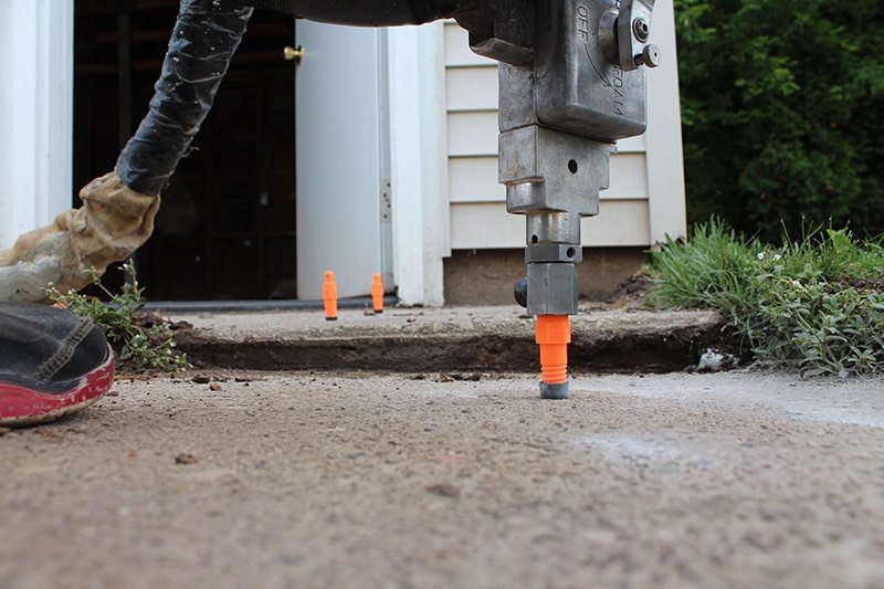 Sinking or unlevel driveway? We can level it.